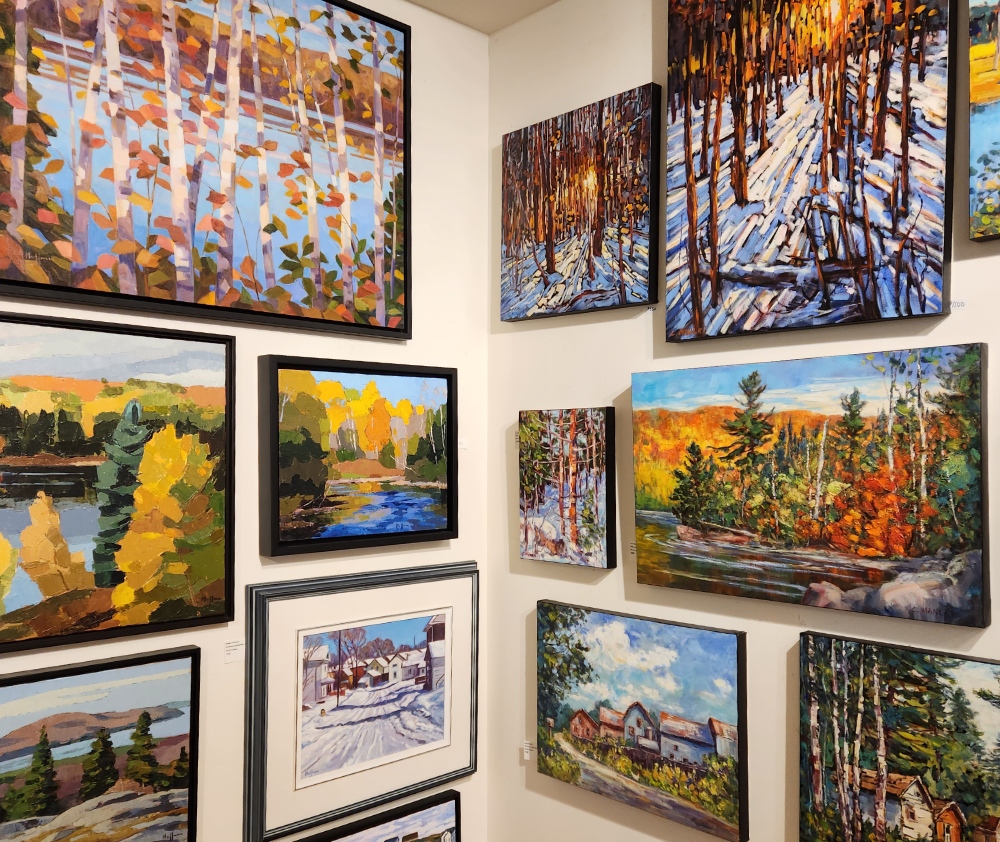 Art displayed on the walls Quinns of Tweed Fine Art Gallery in Tweed, Ontario