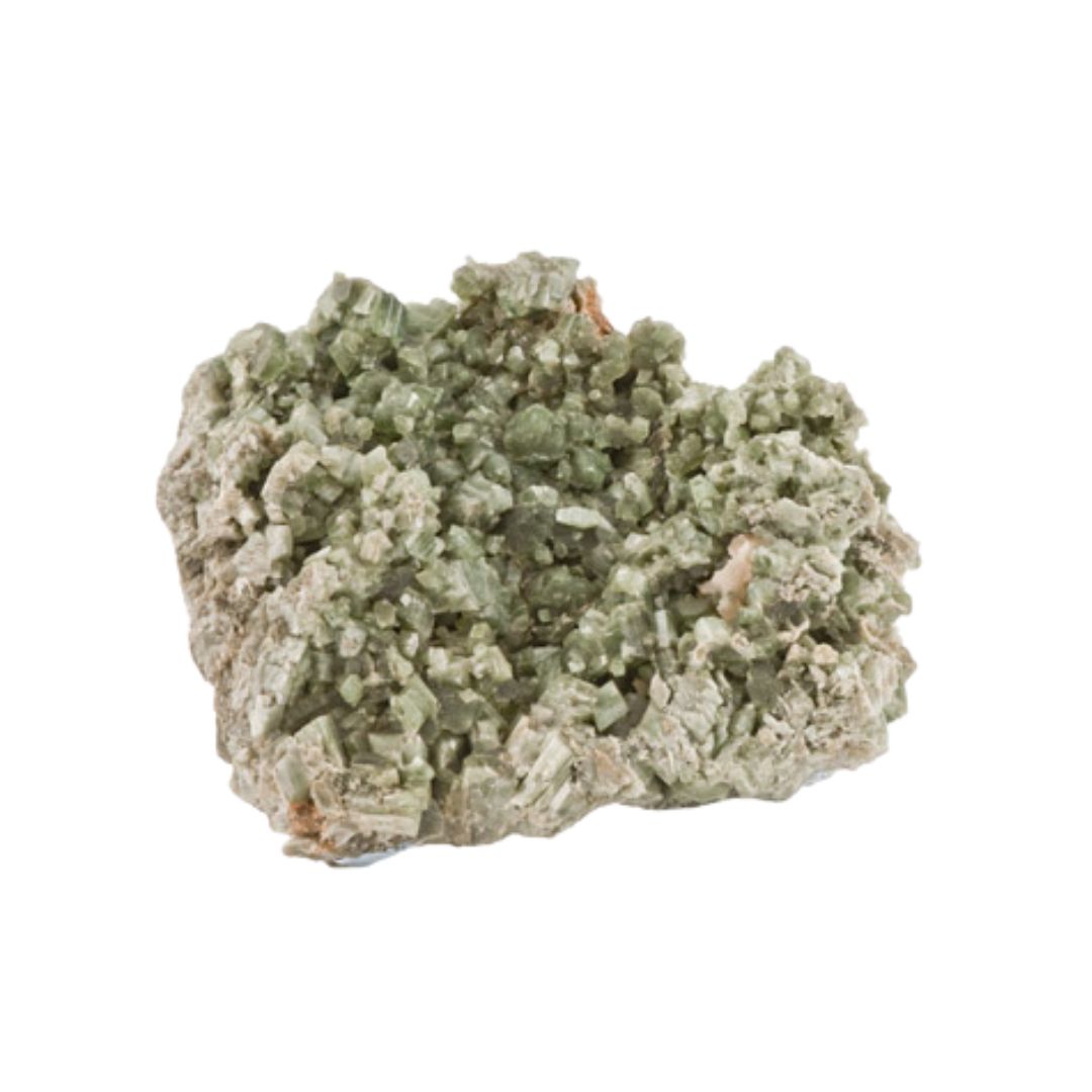 Tremolite mineral on white background. A green and white mineral with jagged edges.