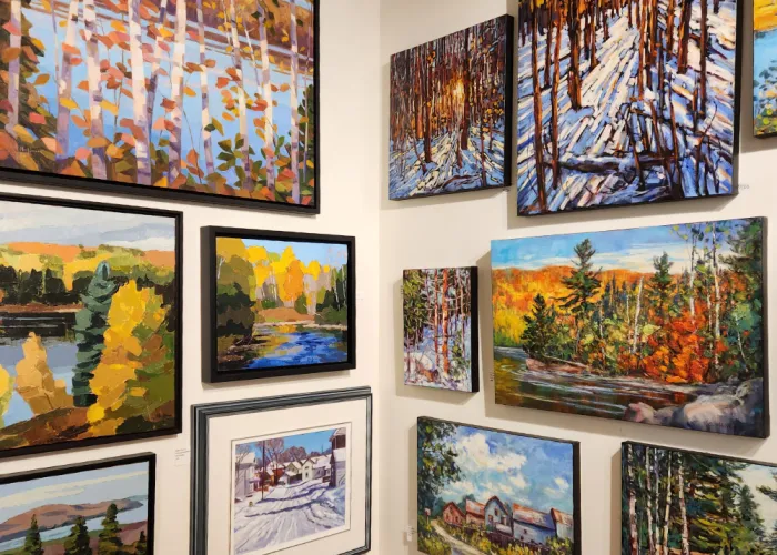 Art displayed on the walls Quinns of Tweed Fine Art Gallery in Tweed, Ontario